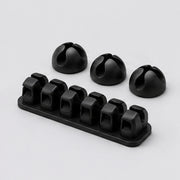 Noviquieo LoopSet Cable Clips in Noviquieo graphite tech product photography