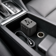 Noviquieo VoltPort Road Kit Adapter stored in a car console